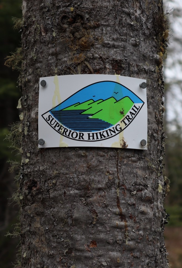 Superior Hiking Trail sign on tree.
